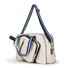 Angled side view of the Hamptons Pickleball Bag by Ame & Lulu with adjustable shoulder strap and interior organizer pockets.