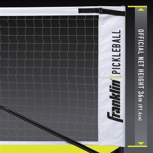 Black and white Franklin Pickleball Portable Net System with wheels and a durable steel frame is easy to set up and move around. Includes black weather-resistant carrying and storage bag.