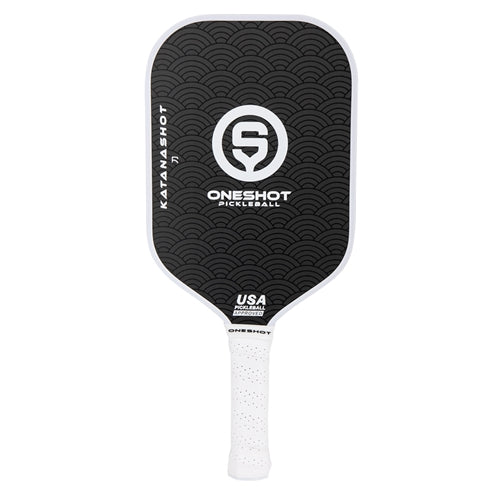 Oneshot Katanashot Carbon Fiber Pickleball Paddle featuring a black paddle background and white Oneshot logo and the Katanashot name down the side. White perforated grip