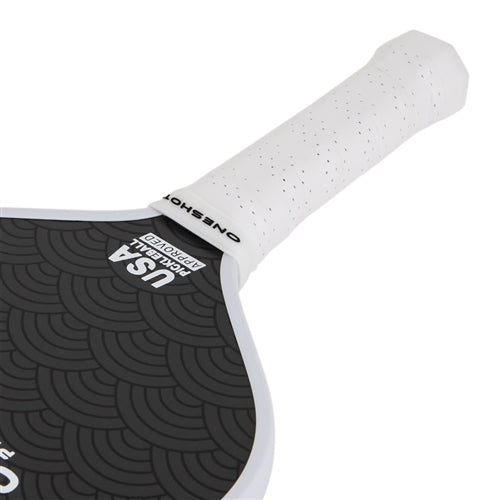 Oneshot Katanashot Carbon Fiber Pickleball Paddle featuring a black paddle background and white Oneshot logo and the Katanashot name down the side. White perforated grip