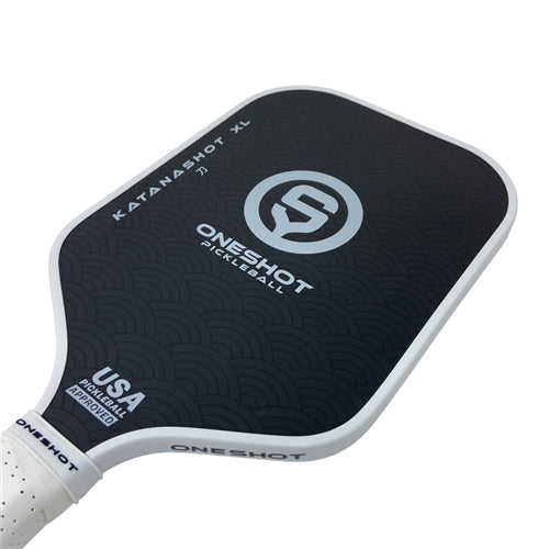 Katanashot XL Paddle by Oneshot Pickleball featuring a black carbon face and white logo, edge guard, and grip