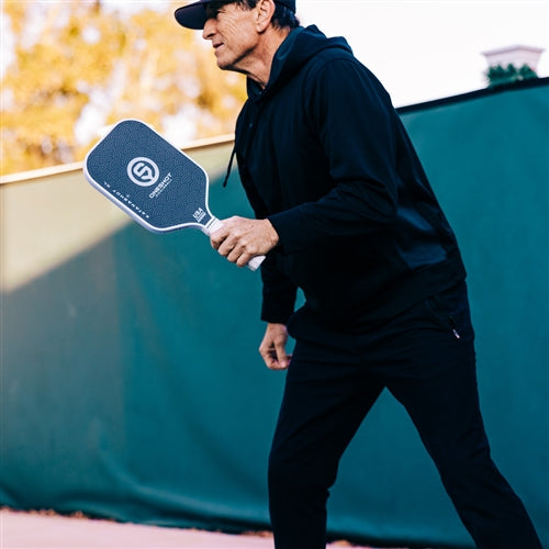 Katanashot XL Paddle by Oneshot Pickleball featuring a black carbon face and white logo, edge guard, and grip