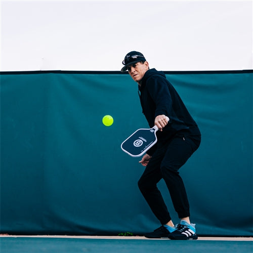 Katanashot XL Paddle by Oneshot Pickleball featuring a black carbon face and white logo, edge guard, and grip