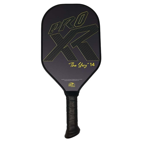ProXR "The Story" 14 Pickleball Paddle has a forehand fiberglass face and backhand carbon fiber face. Black background with large ProXR logos on each side, white outline and details on the fiberglass side, with yellow outline on the backhand side.