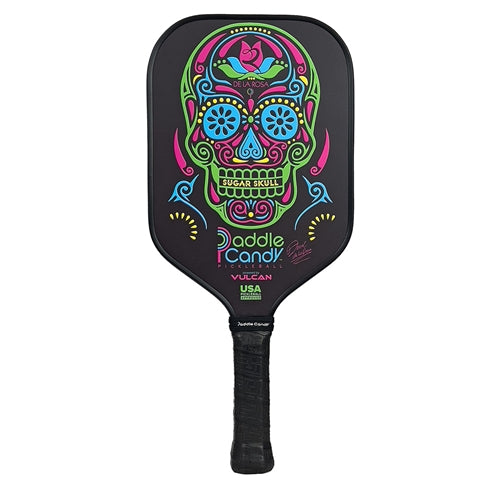 The Daniel De La Rosa Signature Edition Pickleball Paddle from Paddle Candy showcases a bright, sugar skull design on the face, with  the Paddle Candy logo.  Features an elongated handle and tapered neck for an aerodynamic feel.