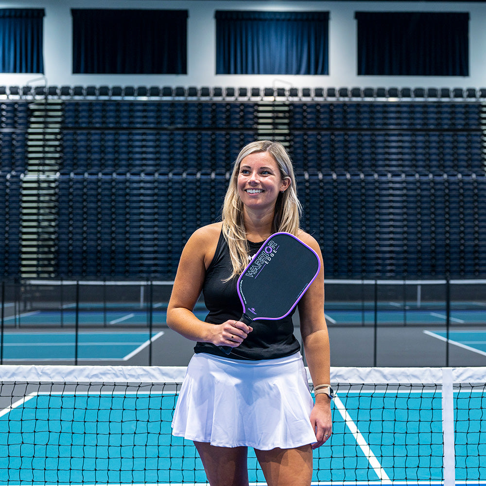 Model posing with Diadem Warrior Edge Carbon Fiber Paddle - Lilac.